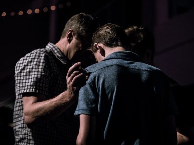 men touching each other's foreheads