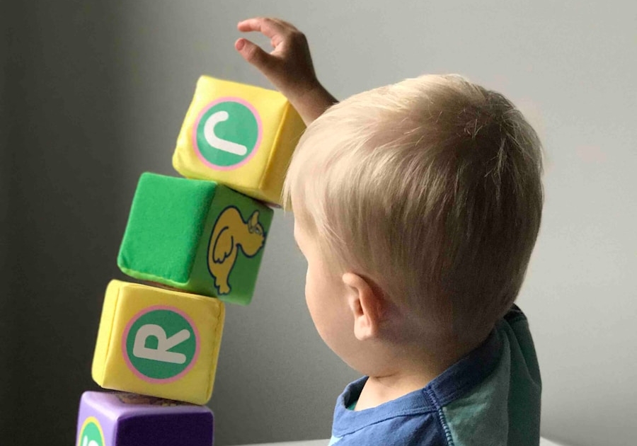boy playing cube on white wooden table